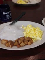 Chicken Fried Steak Smothered in Gravy Scrambled Eggs Home Fries Wheat Toast